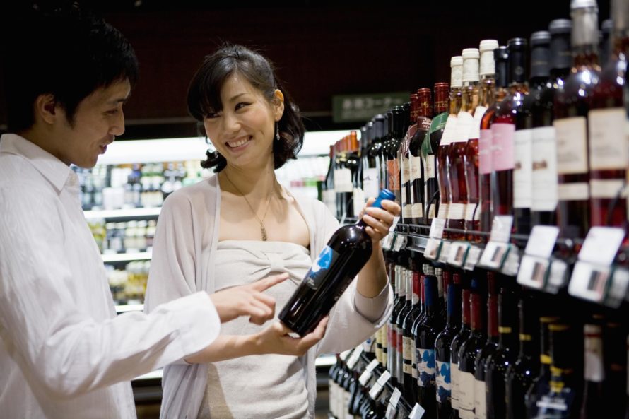 people buying wine at wine store