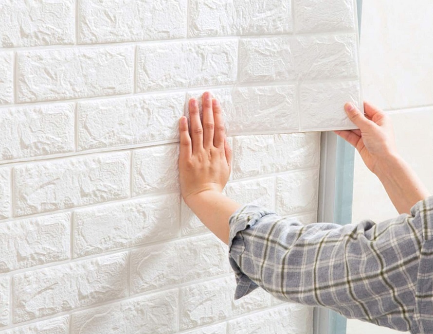 Applying brick wallpaper to the wall