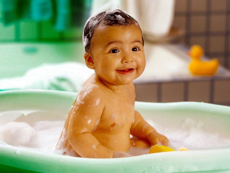 picture of an infant having a bath