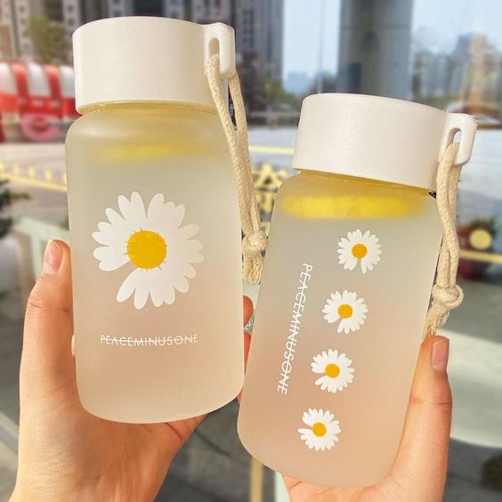 two water bottles with flowers