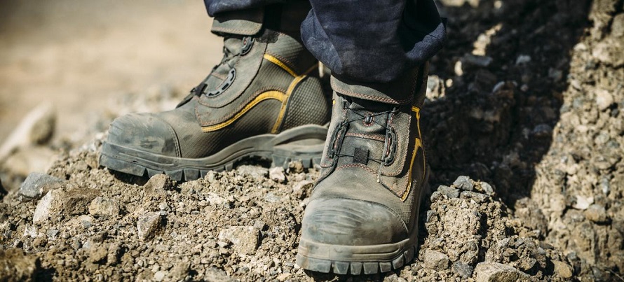men wearing work boots in mountain
