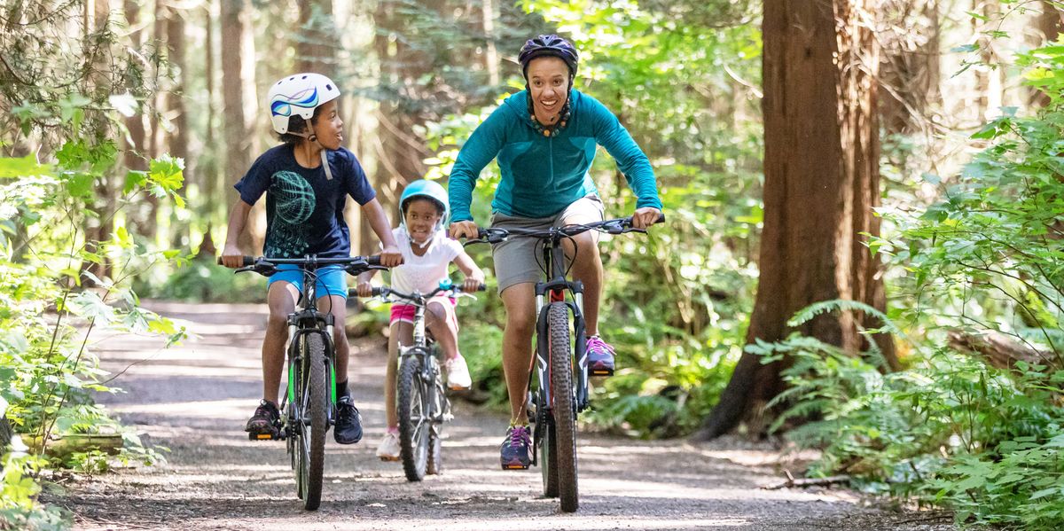 mom-and-kids-race-on-bikes-royalty-free-image-1622673789