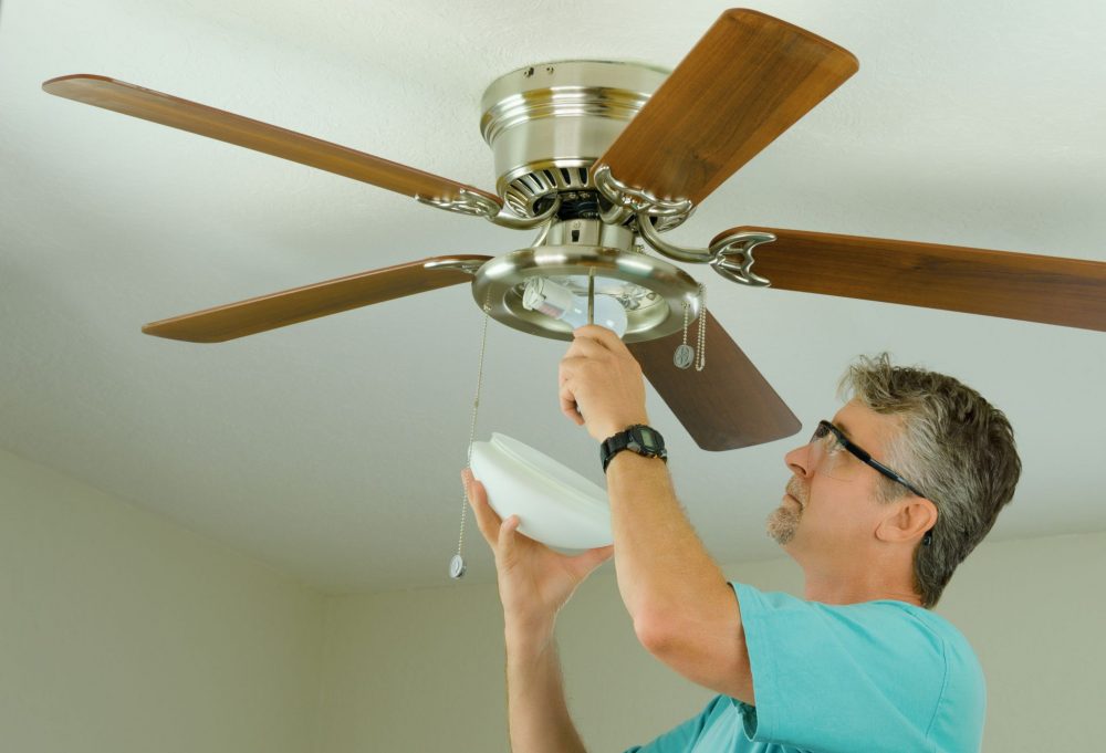 Man-installing-Ceiling-Fan