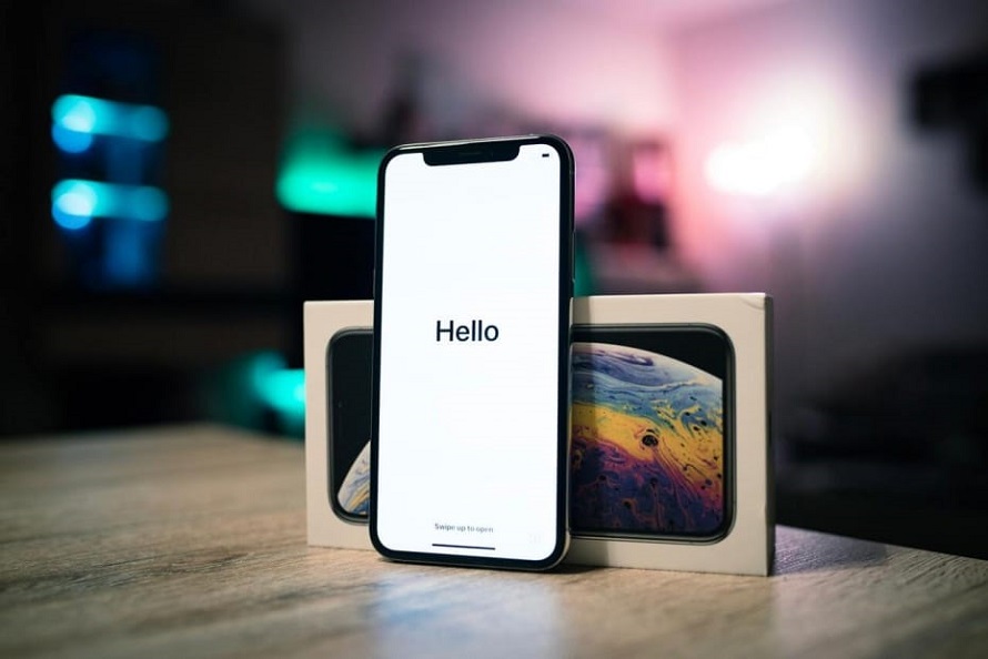 Close-up of iphone with Hello on screen