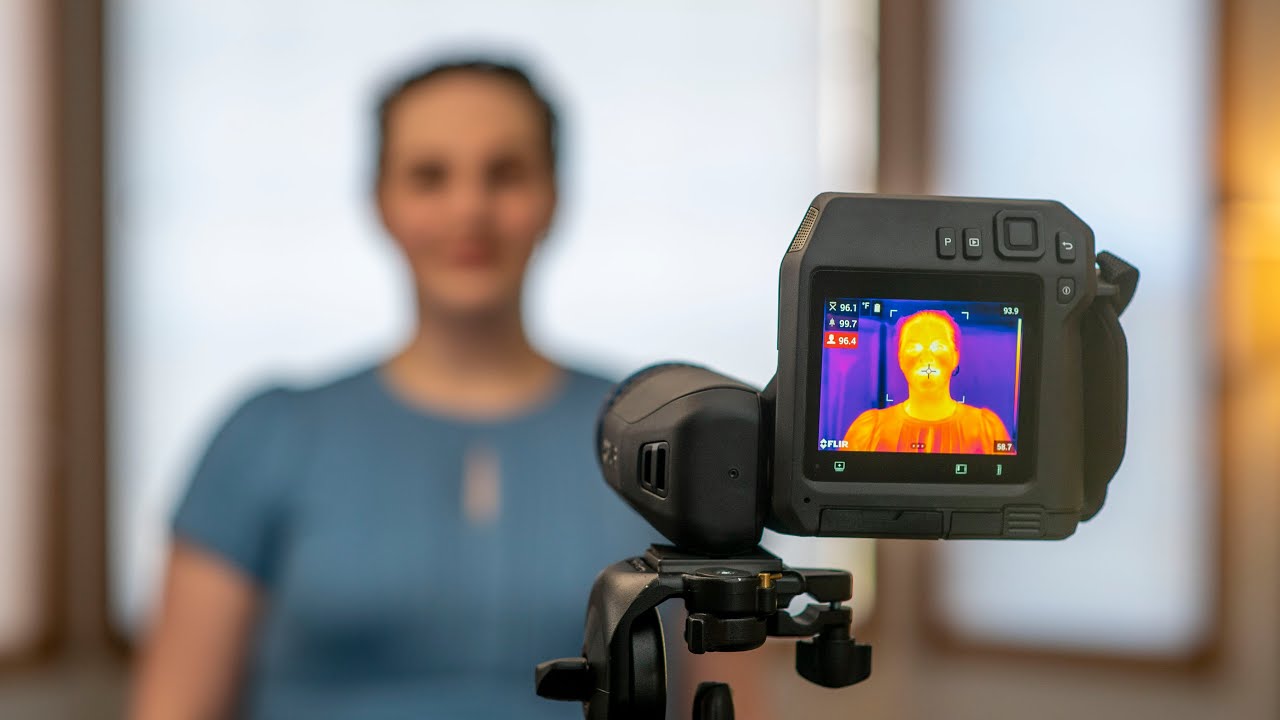 Thermal image camera scanning a woman