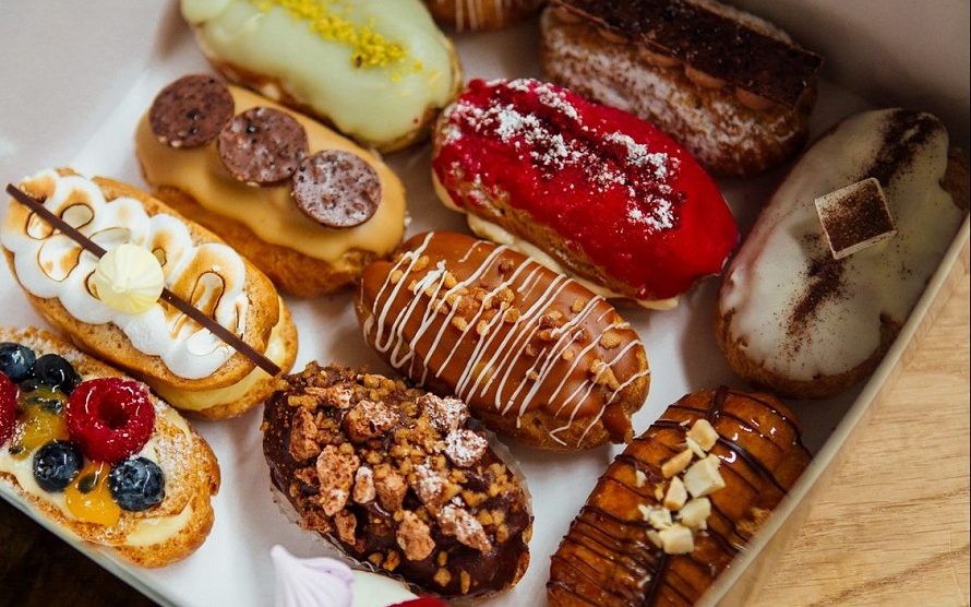 box of assorted eclairs on table 