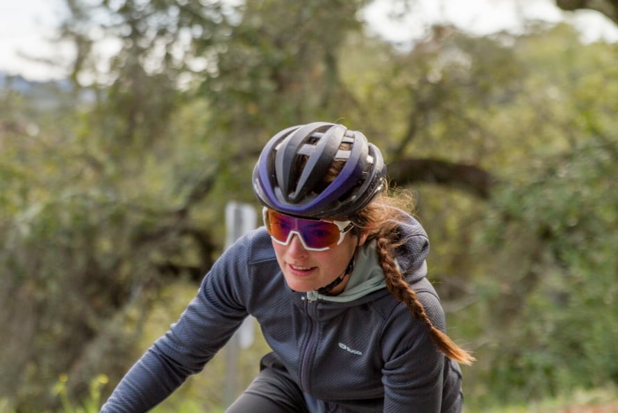 woman driving bike with glasses and helmet