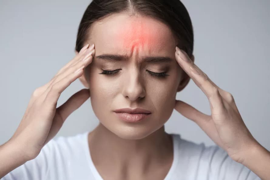 a girl having headaches