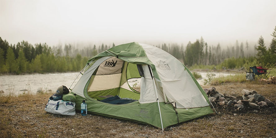 tent-near-river-camping-equiplemnt