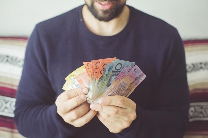 Man counting Australian money