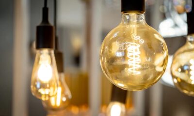 Close-up view of warm-toned LED light globes hanging from black fixtures