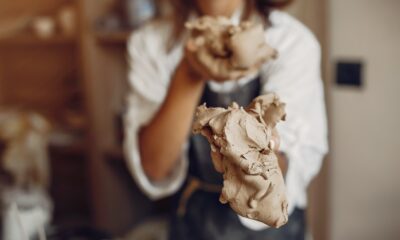 woman holding clay