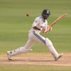 cricket player wearing cricket helmet