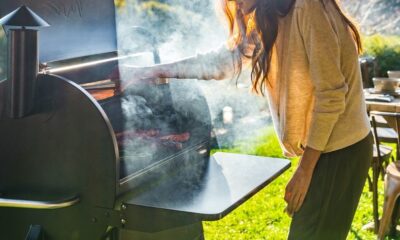 woman making barbeque on a smoker