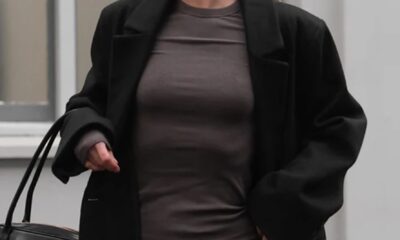 girl in a dress and black coat