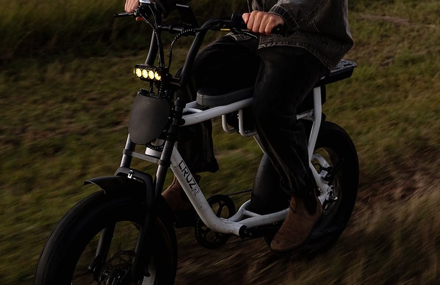 man driving an electric scooter from Cruzr